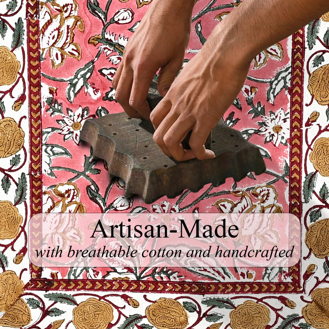 Person using a stamp on a floral-patterned fabric with &