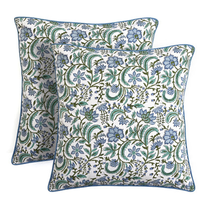 Two floral patterned pillows on a white background