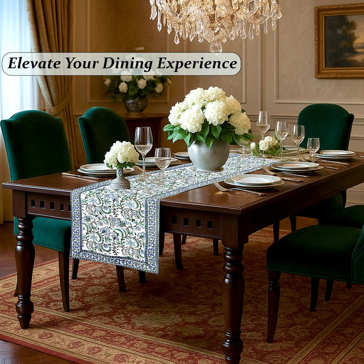 Dining room with a table set for dinner, flowers, and a chandelier.