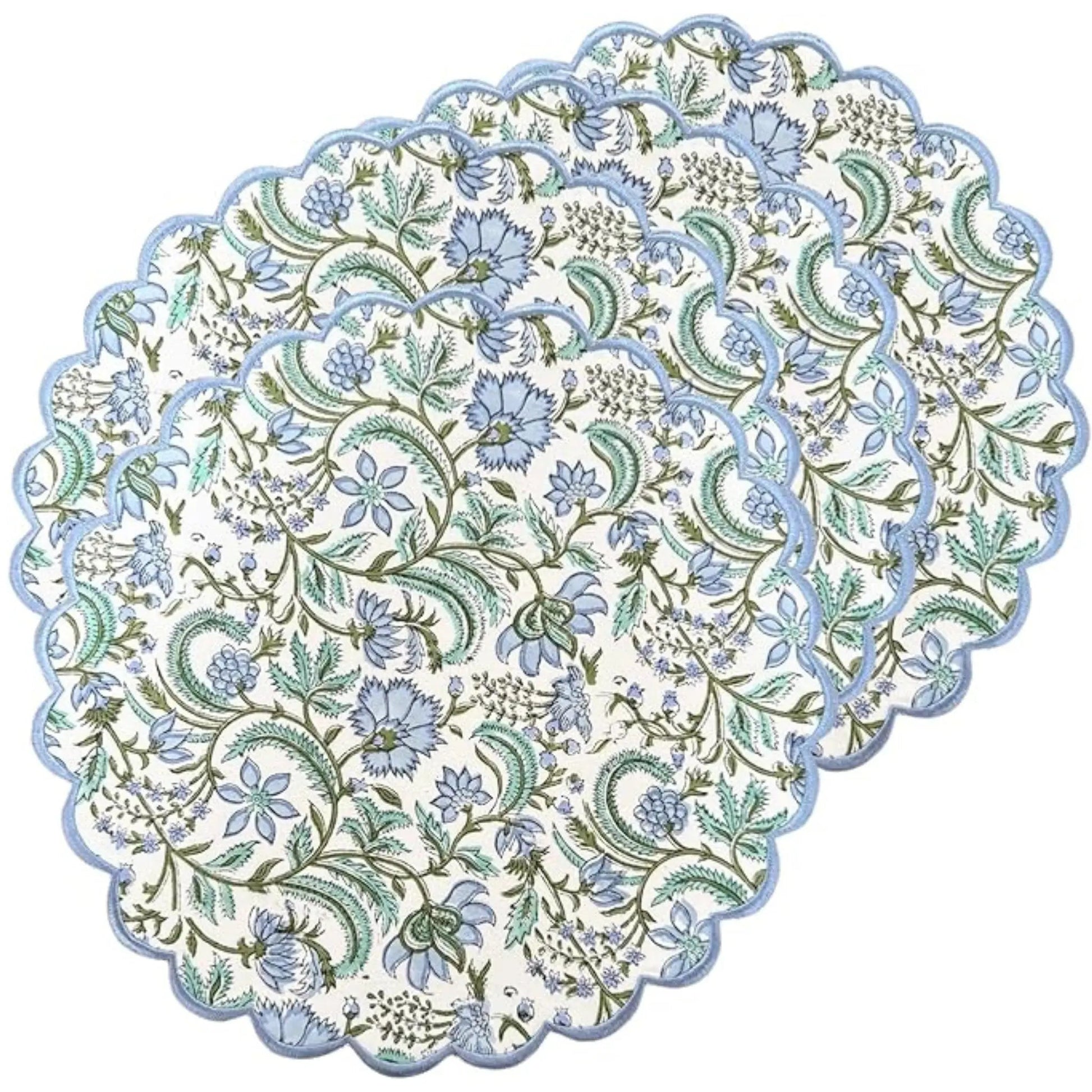four blue floral placemats on a white background