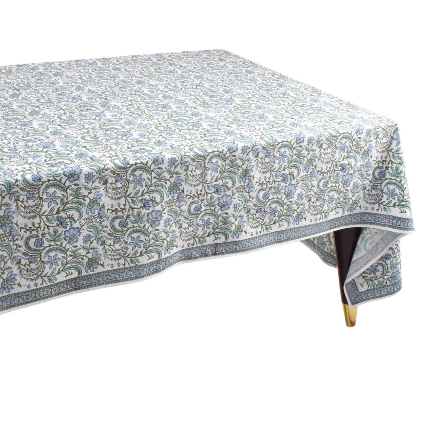 Tablecloth with floral pattern on a wooden table