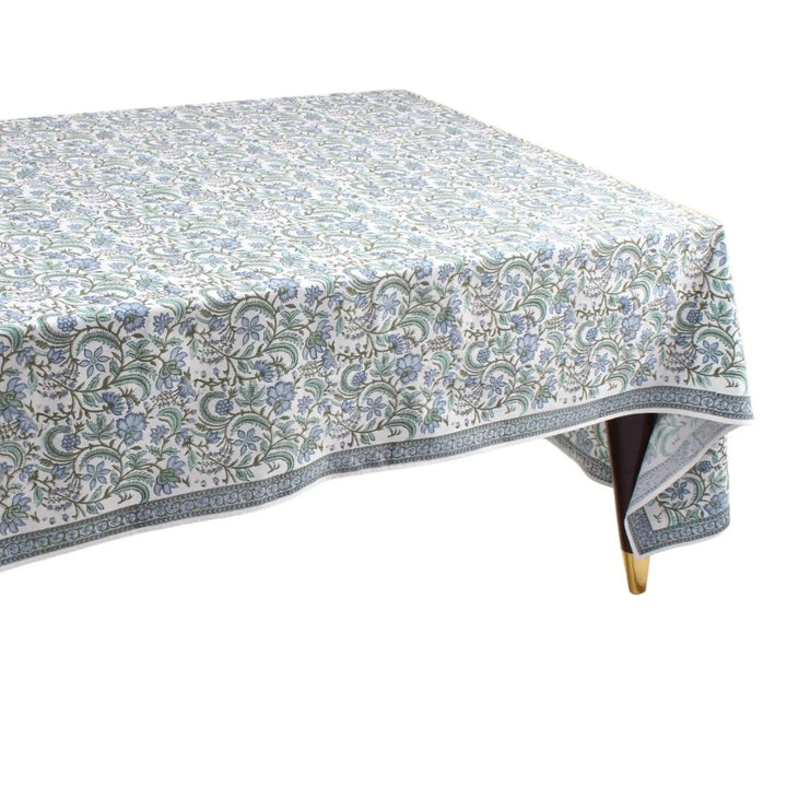 Tablecloth with floral pattern on a wooden table