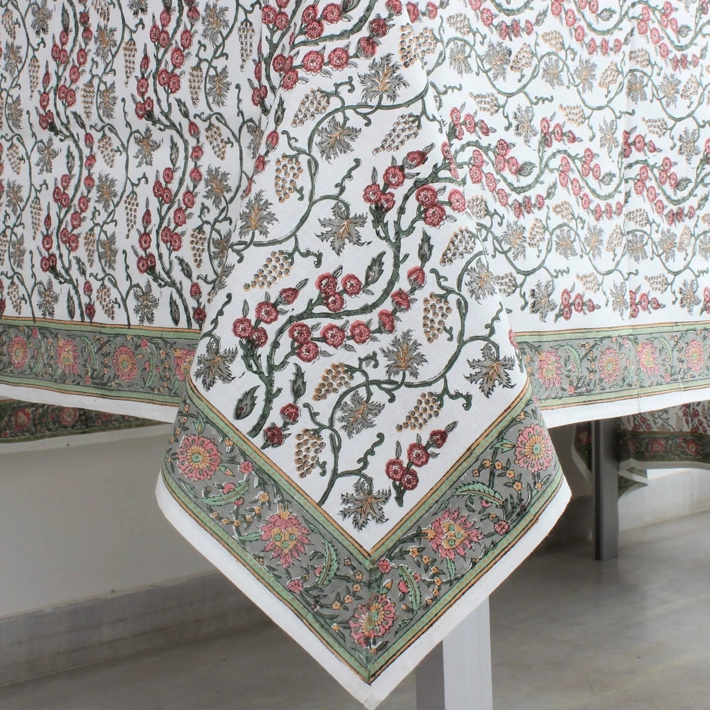 Floral patterned tablecloth on a white table