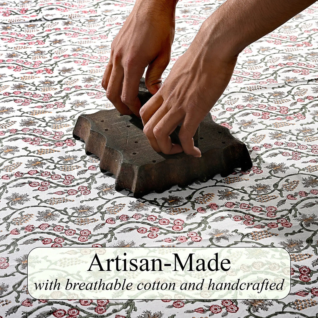 Hand using a stamp on fabric with &
