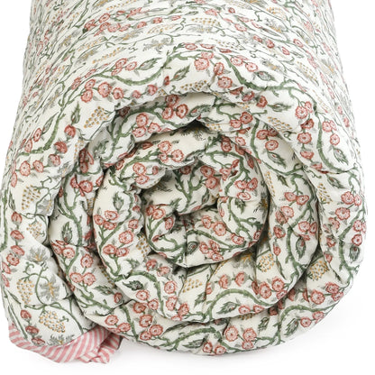 Rolled-up floral-patterned fabric on a white background