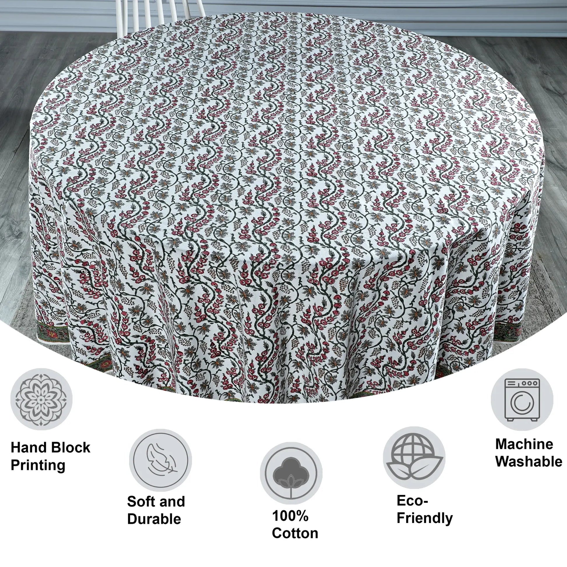 Round tablecloth with floral pattern on a wooden floor, featuring icons and text about material and care.