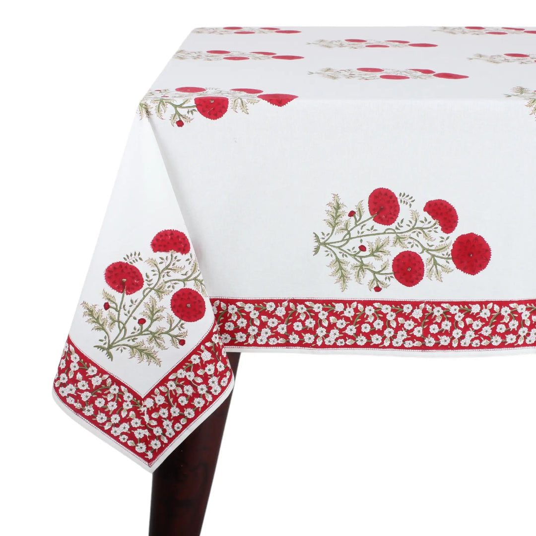 Decorative tablecloth with red floral patterns on a white background