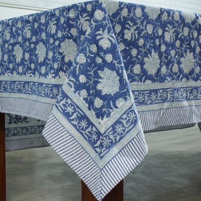 Blue floral patterned tablecloth on a wooden table