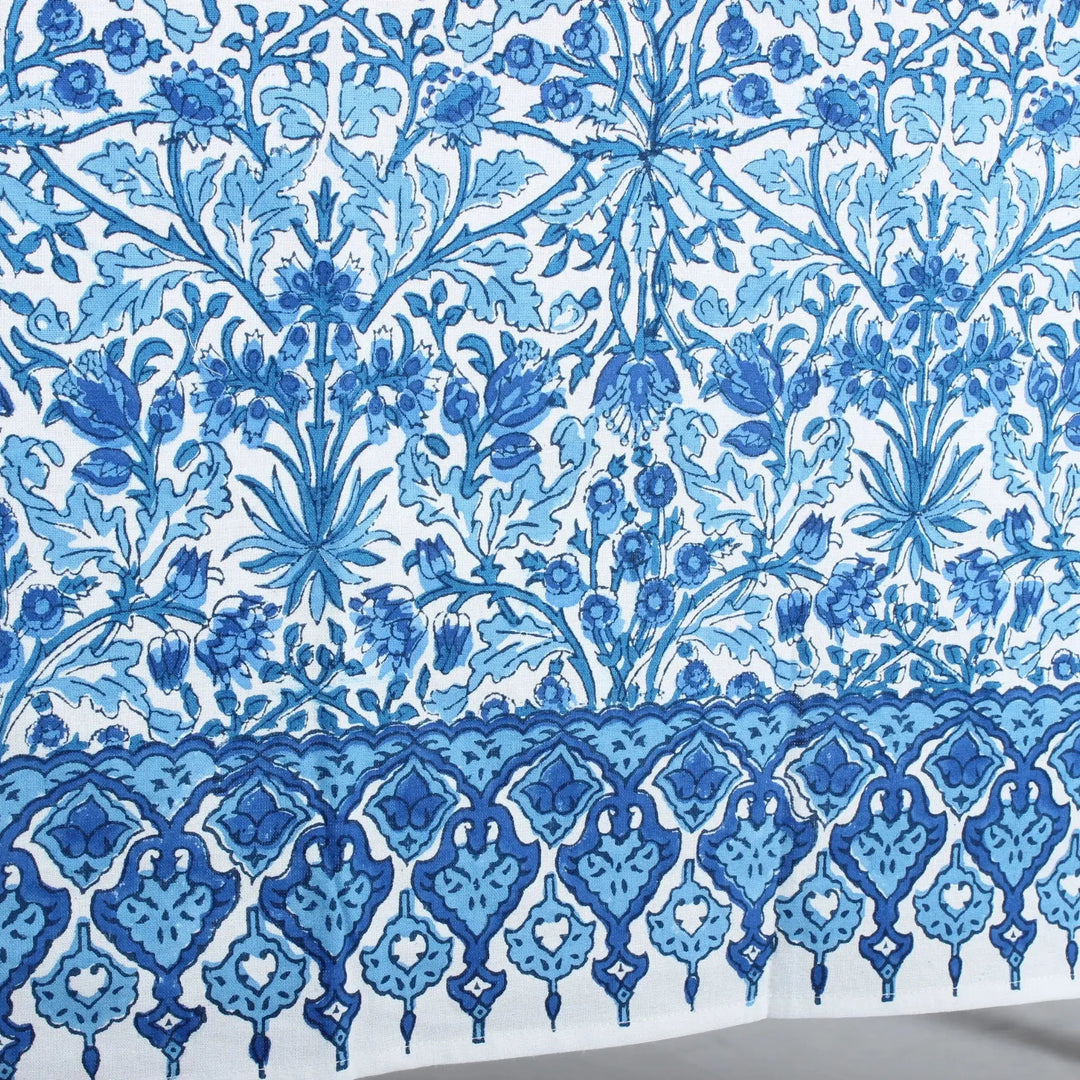 Blue floral and geometric pattern on a white background