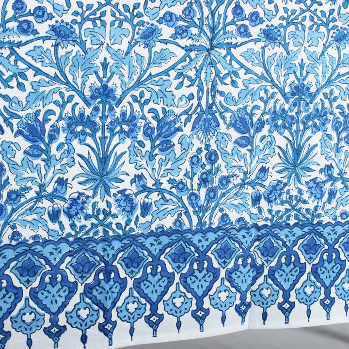 Blue floral and geometric pattern on a white background