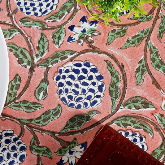 Close-up of a fabric with floral pattern on a pink background