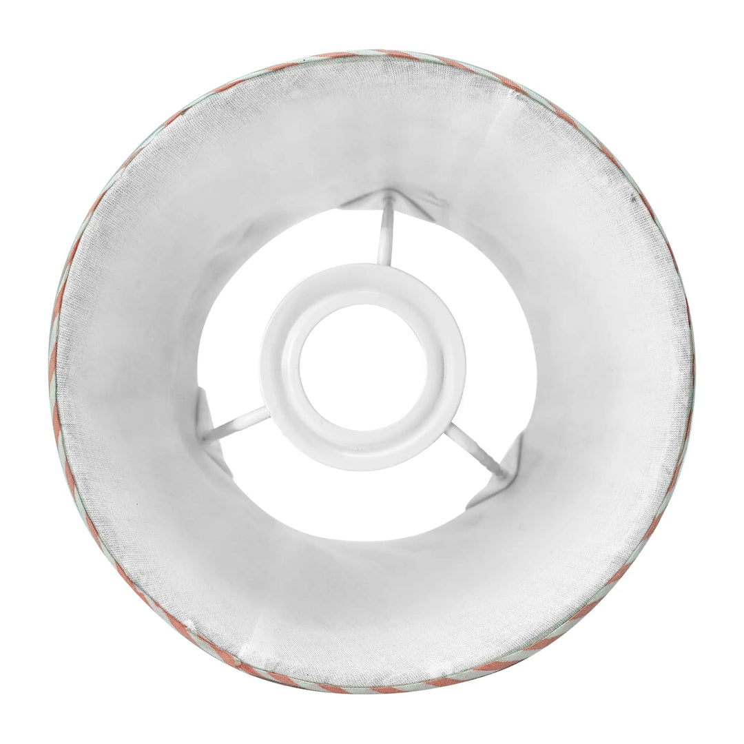 Round metal ring with a central hole on a white background