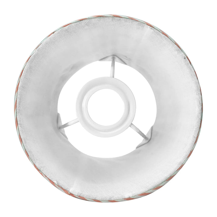 Round metal ring with a central hole on a white background