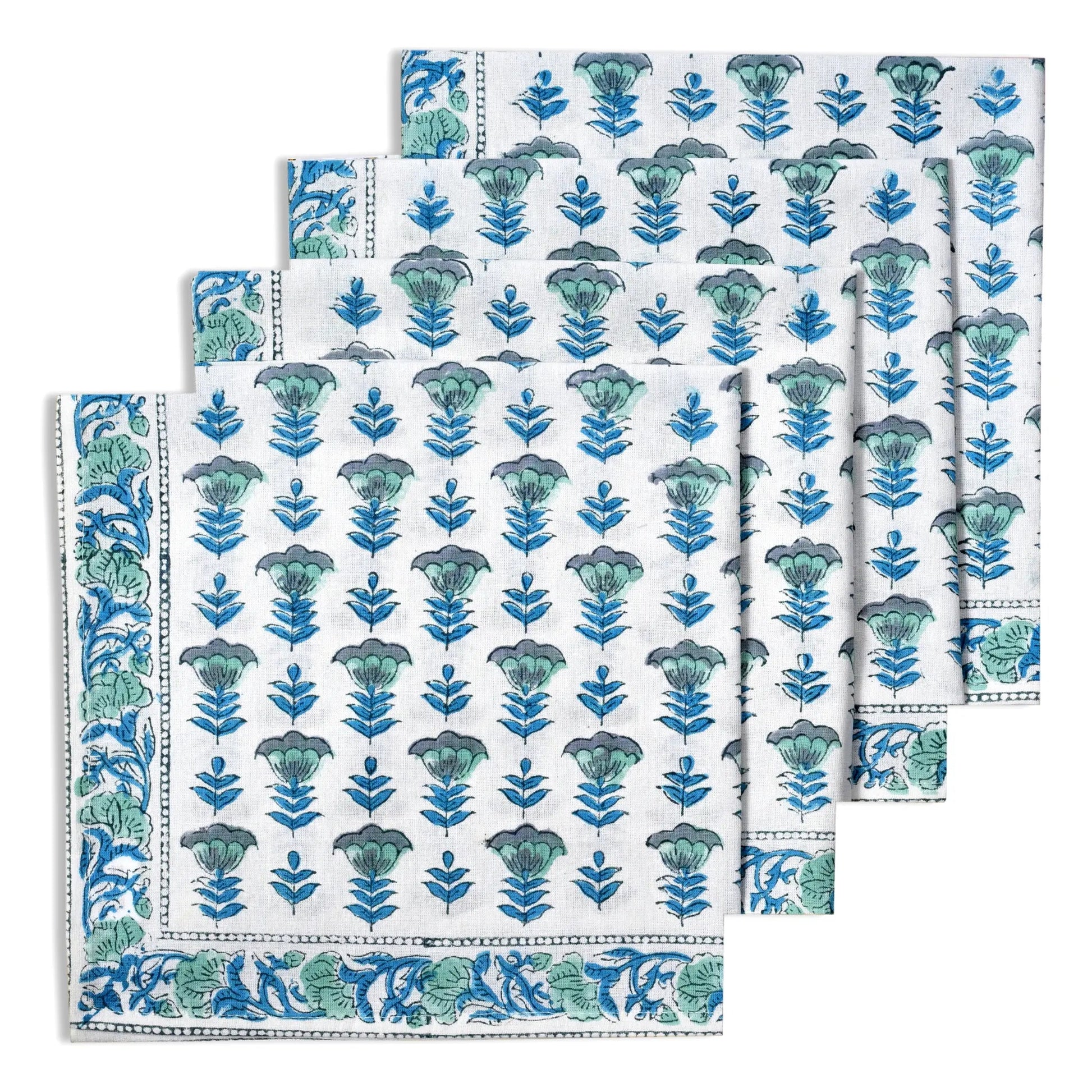 Set of folded towels with blue floral pattern on a white background