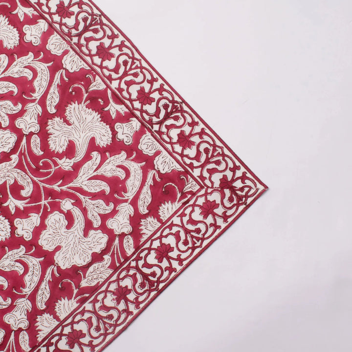 Red and white floral patterned fabric on a white background