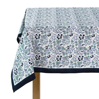 Tablecloth with floral pattern and navy border on a white background