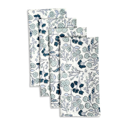 Set of four floral-patterned towels on a white background
