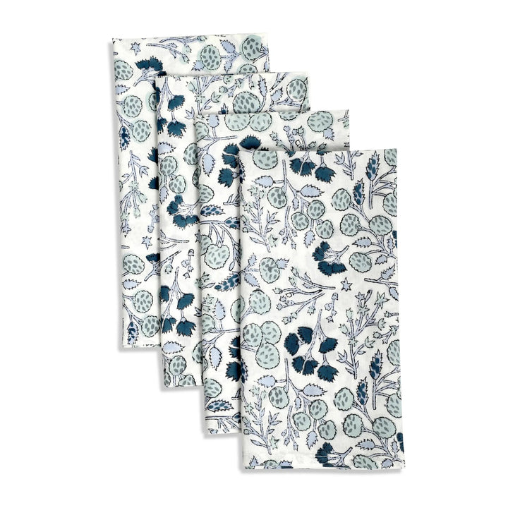 Set of four floral-patterned towels on a white background