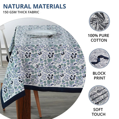 Floral patterned tablecloth on a table with natural materials text and images.