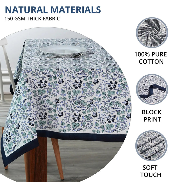 Floral patterned tablecloth on a table with natural materials text and images.