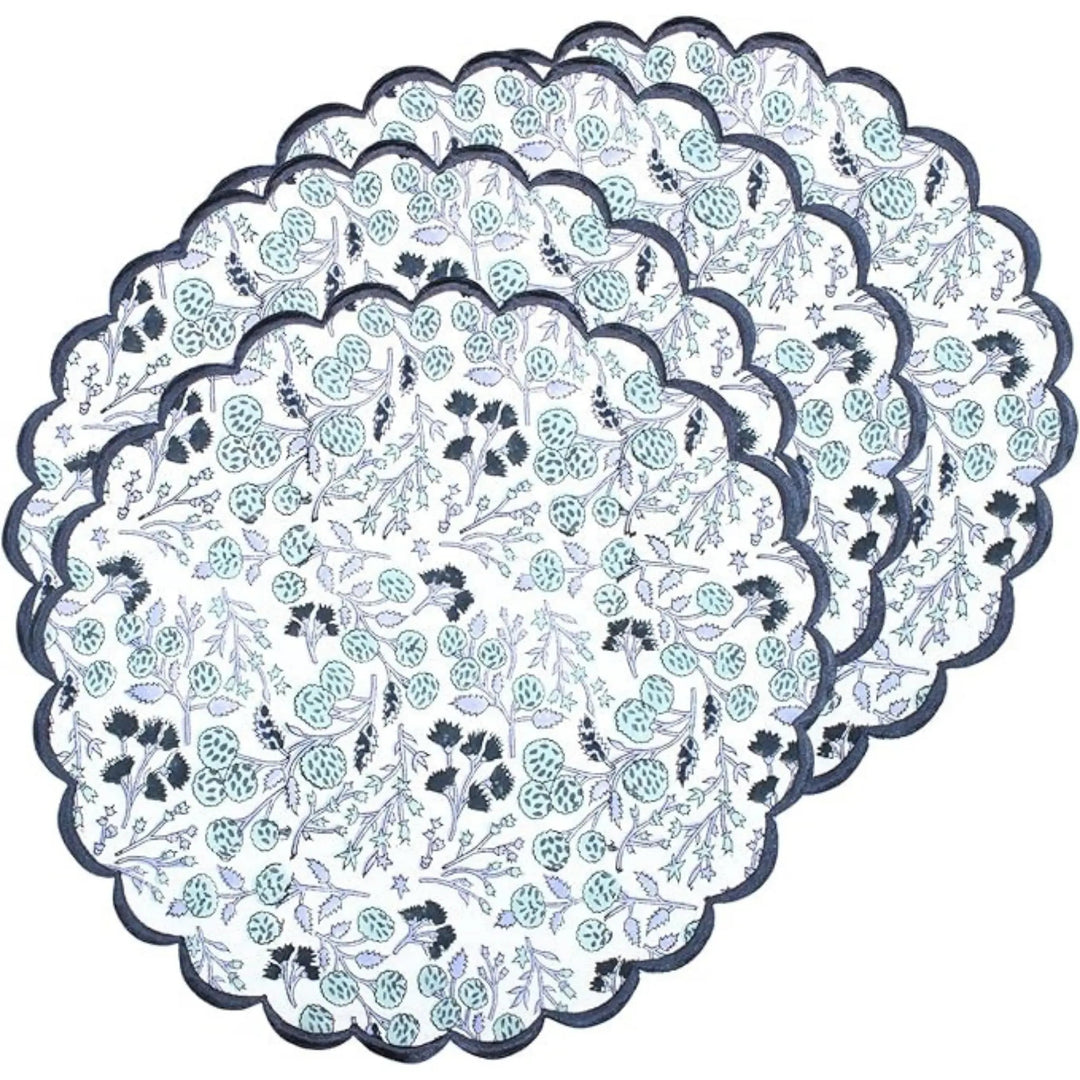 Set of floral-patterned paper doilies on a white background