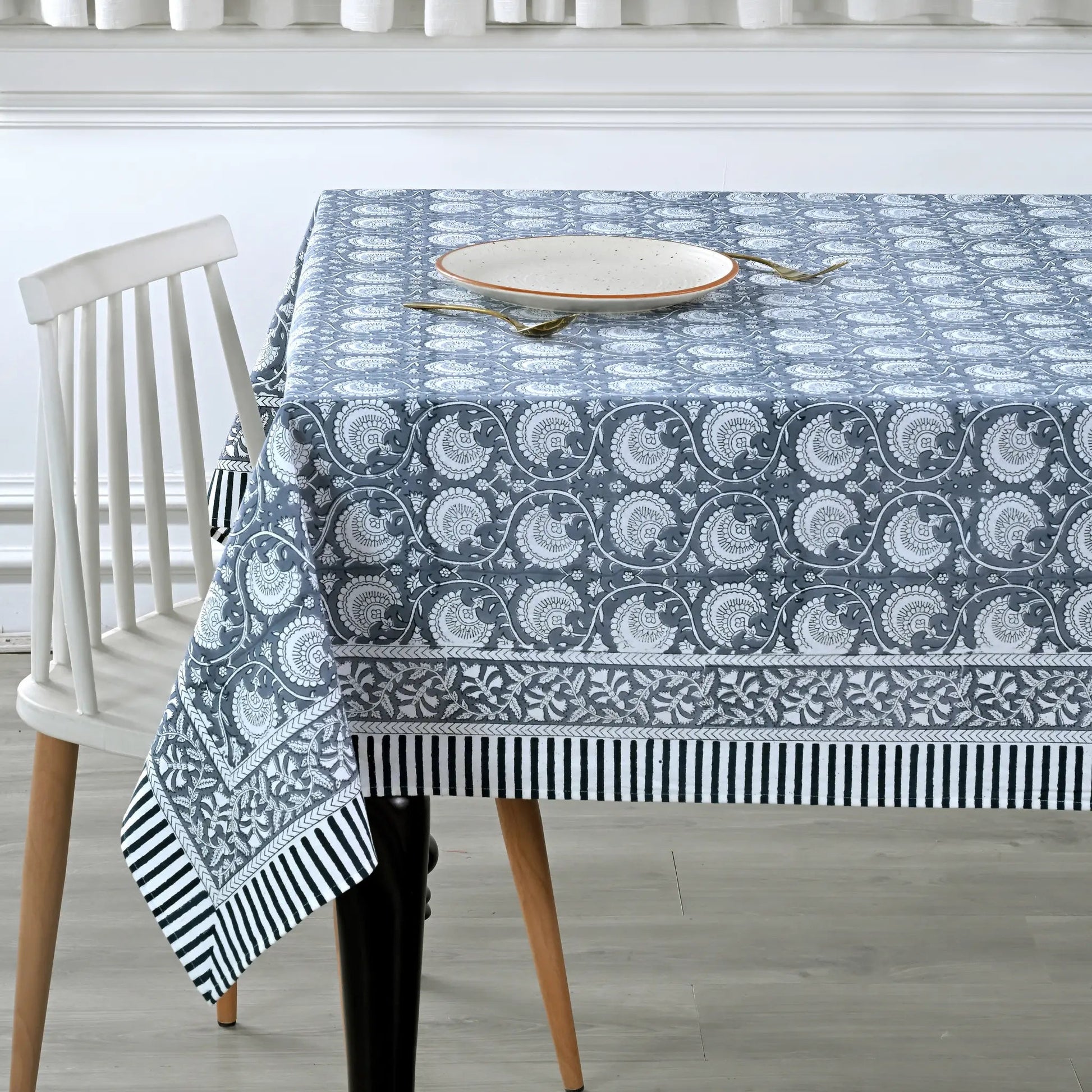 Tablecloth with blue and white pattern on a dining table