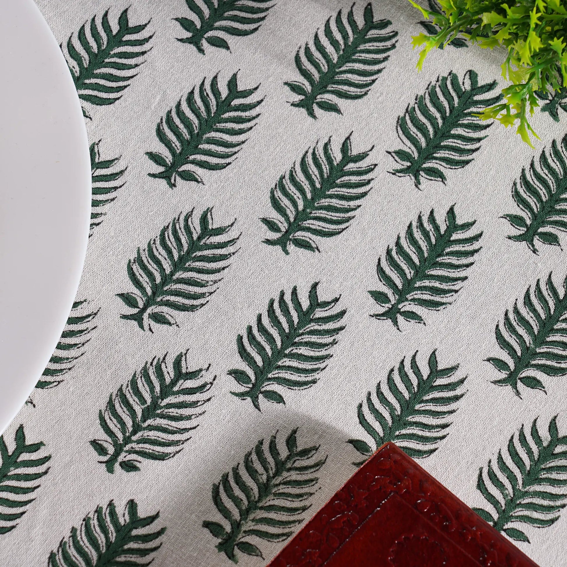 Textile with green leaf pattern on a gray background