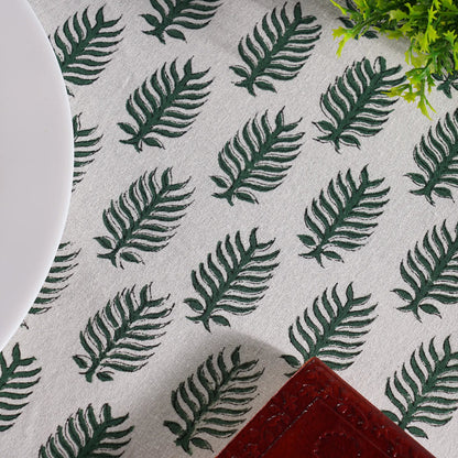 Textile with green leaf pattern on a gray background