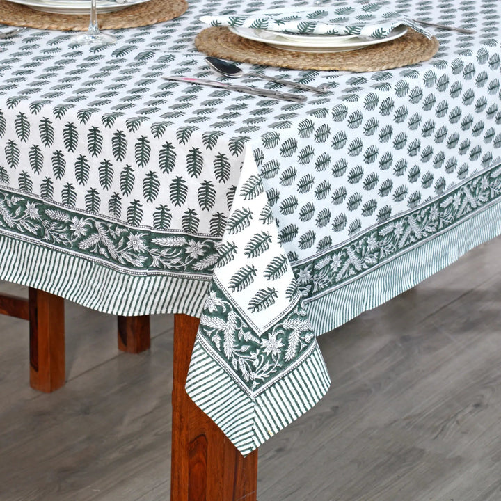 Tablecloth with leaf pattern on a wooden table
