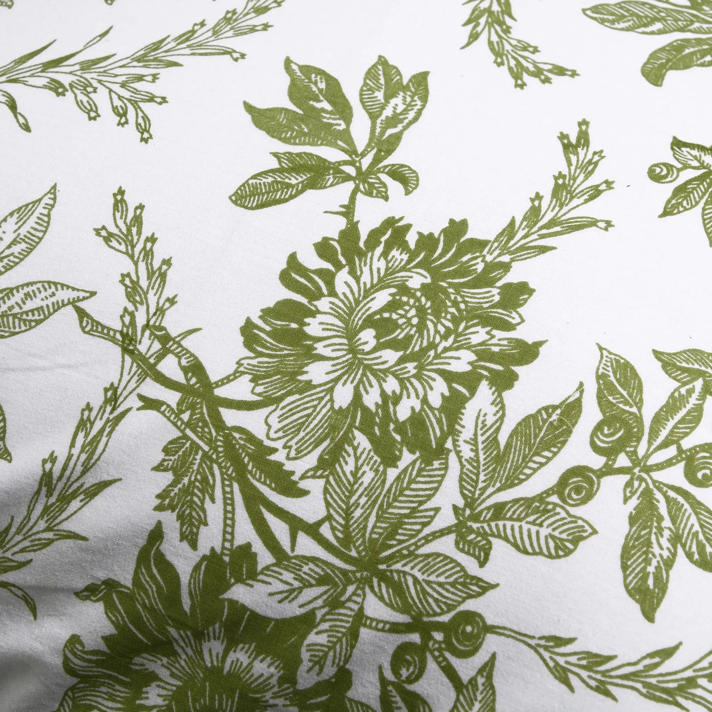 Pattern of green floral and leaf designs on a white background
