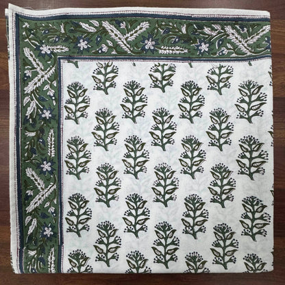 Fabric with floral pattern on a wooden surface