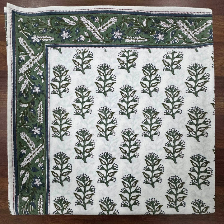 Fabric with floral pattern on a wooden surface