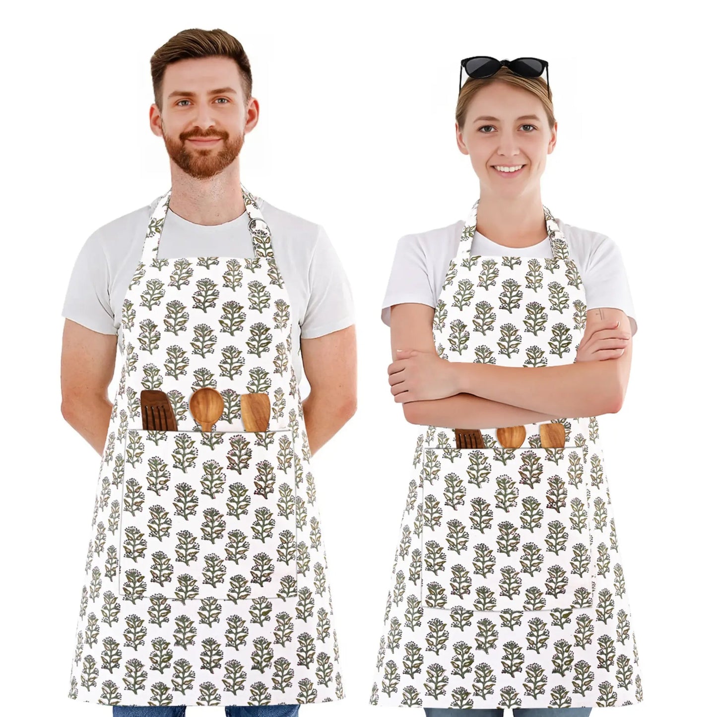 Two people wearing aprons with a floral pattern on a white background