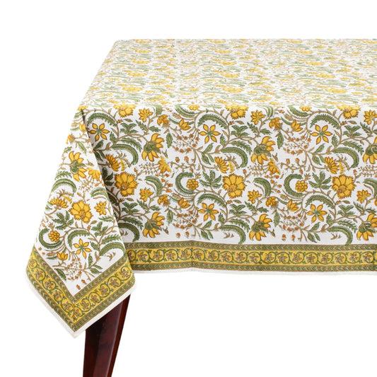 Floral patterned tablecloth with yellow and green design on a white background
