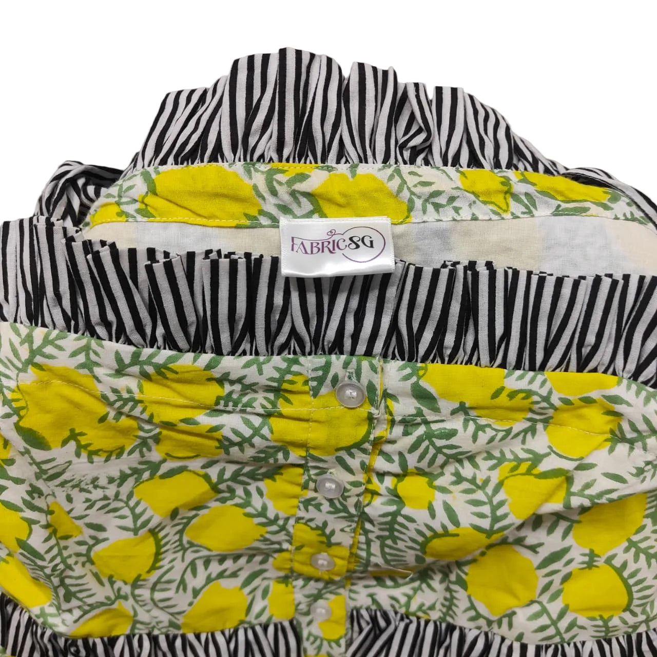 Floral and zebra patterned shirt with a visible brand label on a gray background