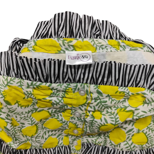 Floral and zebra patterned shirt with a visible brand label on a gray background