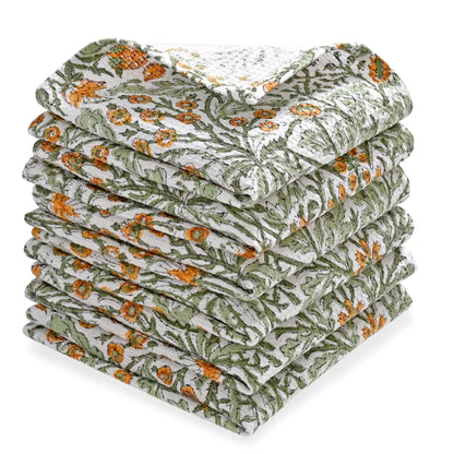 Stack of floral-patterned towels on a white background