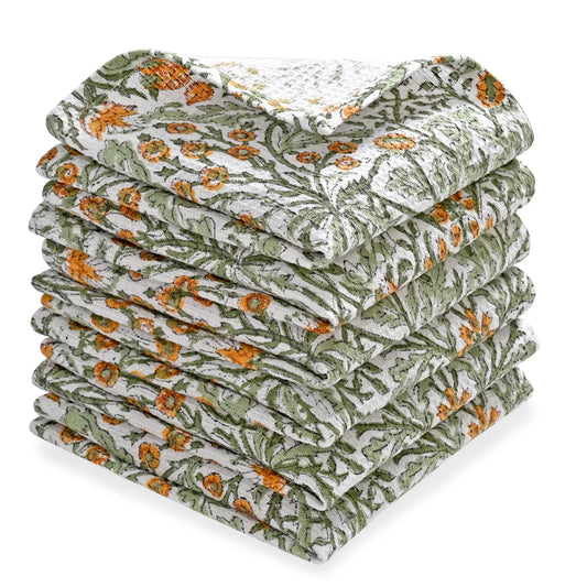 Stack of floral-patterned towels on a white background