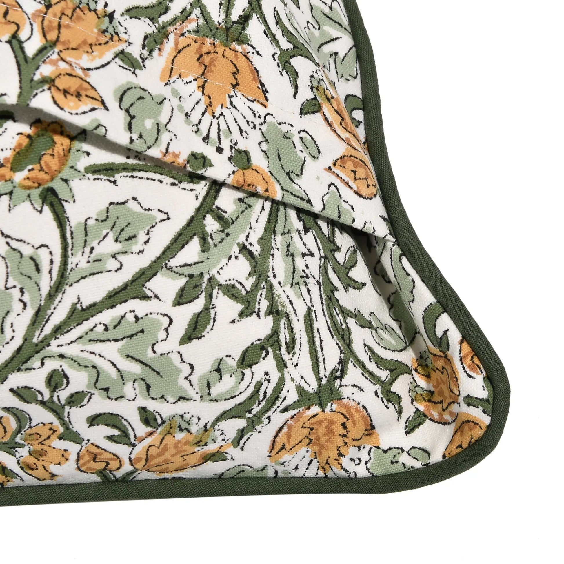 Floral patterned fabric with green, orange, and white colors on a white background