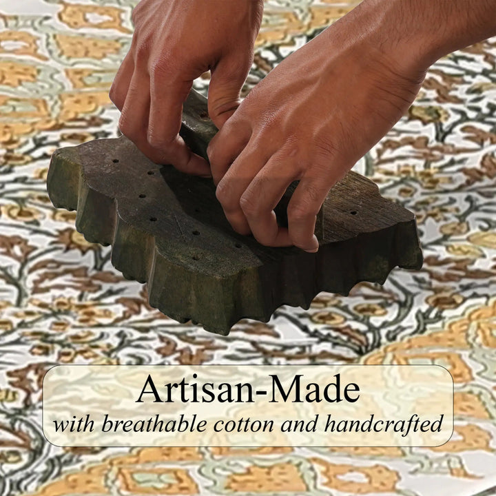 Hands using a wooden tool on fabric with &