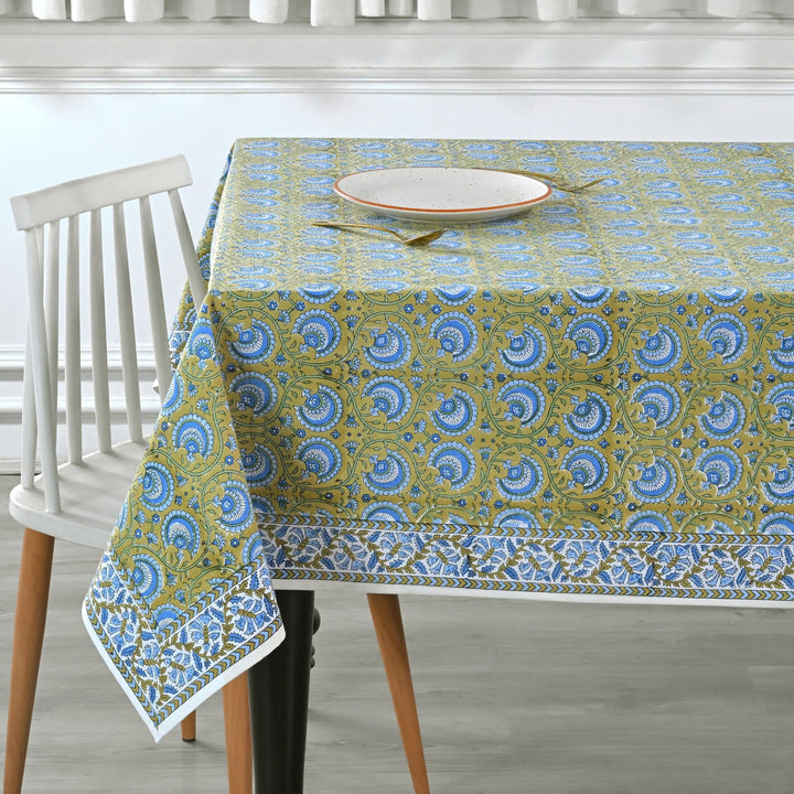 Tablecloth with blue and green pattern on a dining table