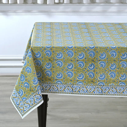 Tablecloth with blue and green pattern on a wooden table
