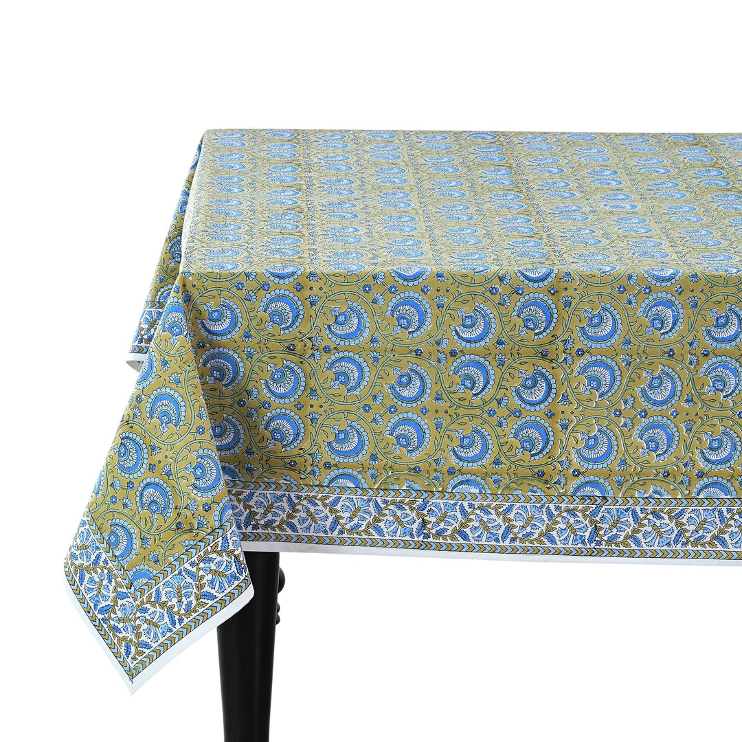 Patterned tablecloth on a table with a white background