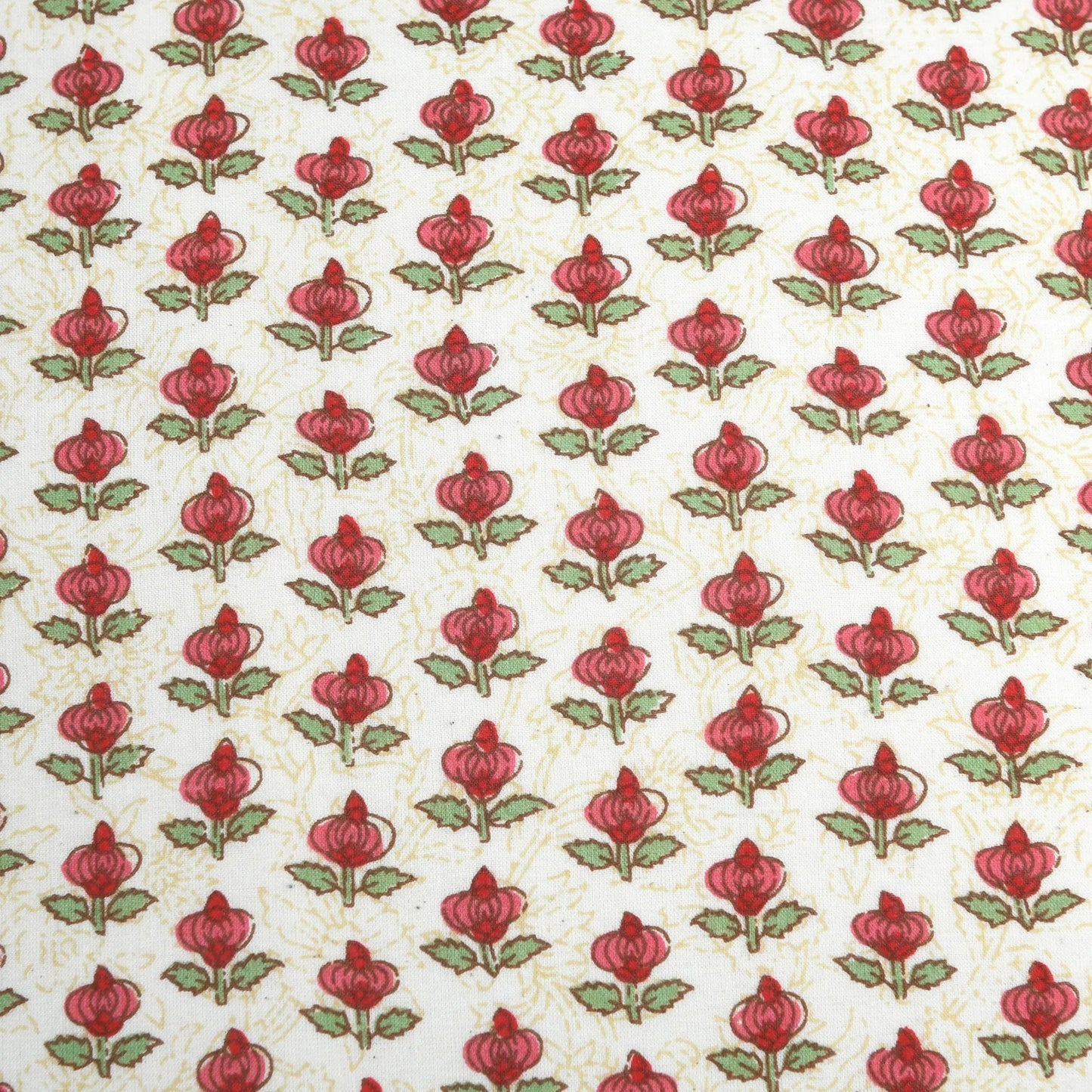 Pattern of red flowers with green leaves on a beige background