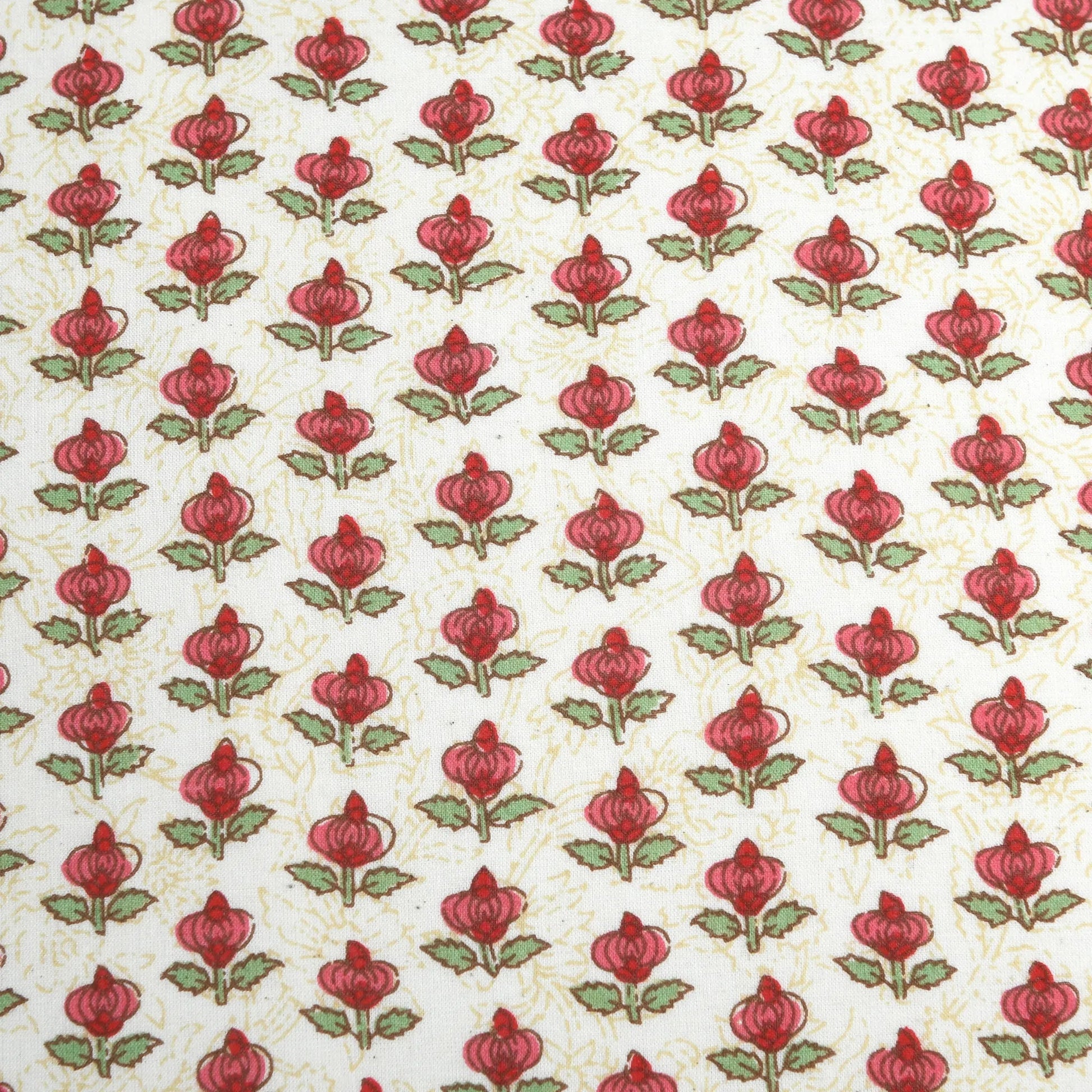 Pattern of red flowers with green leaves on a beige background