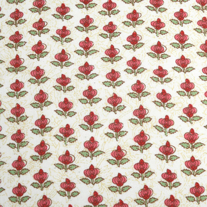 Pattern of red flowers with green leaves on a beige background