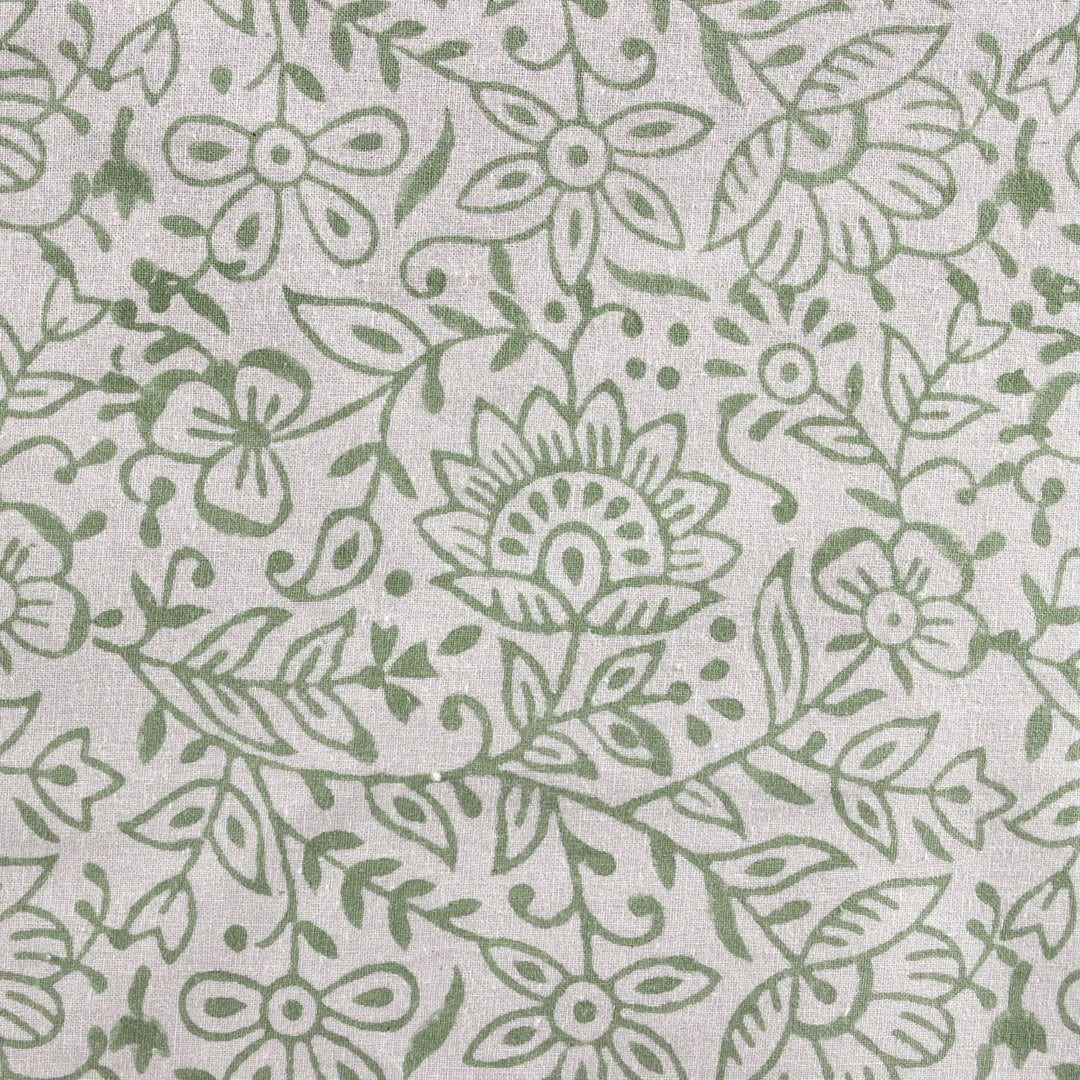 Green floral pattern on a light gray background