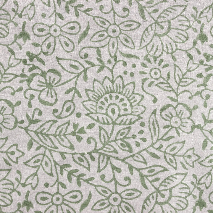 Green floral pattern on a light gray background