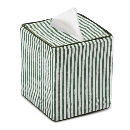 Green and white striped tissue box with a tissue peeking out on a white background