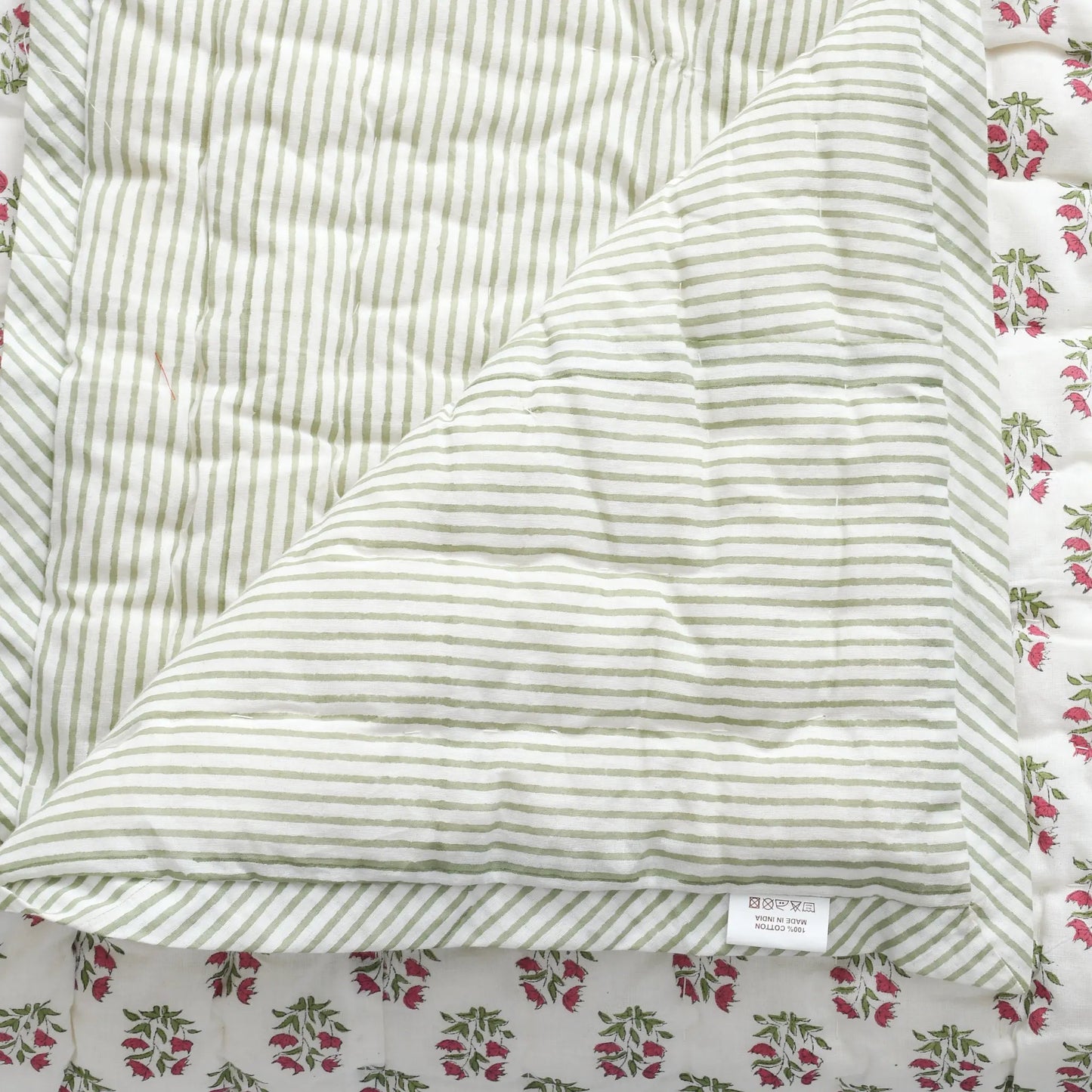 Striped fabric with a floral patterned border
